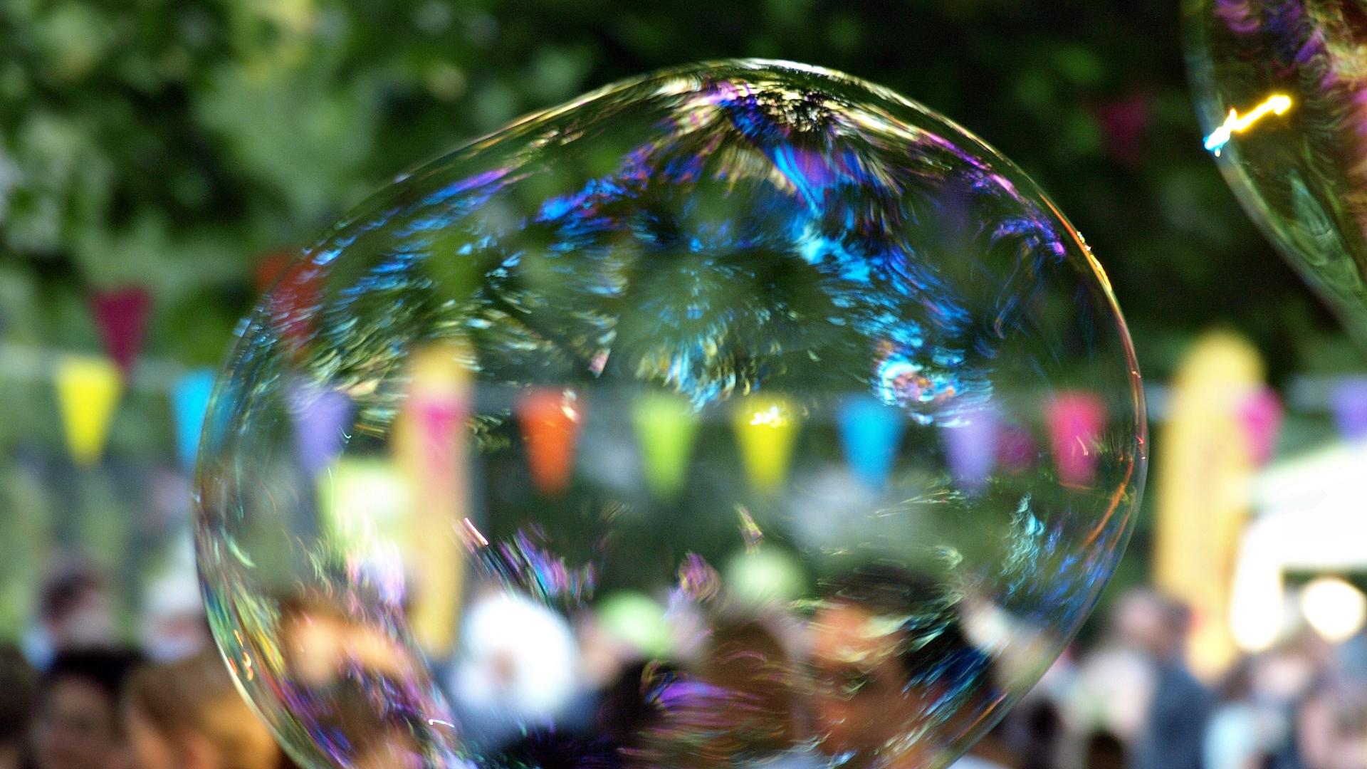 Bubble in front of colorful bunting at a festival