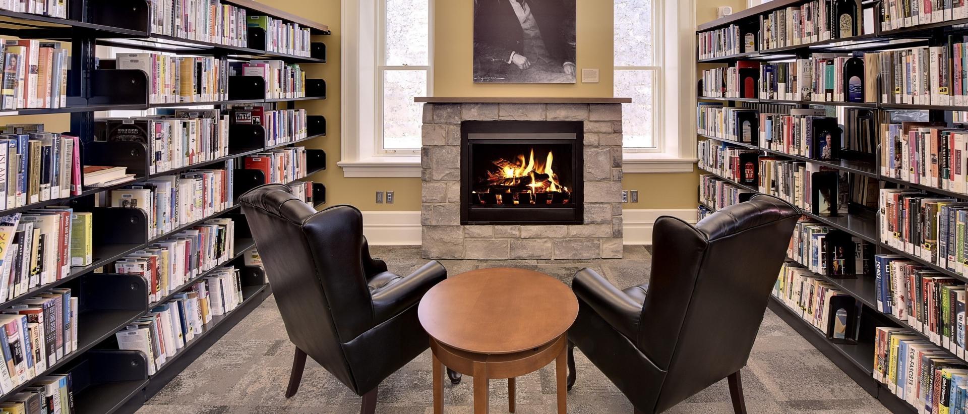Fireplace and chairs inside Fergus Branch